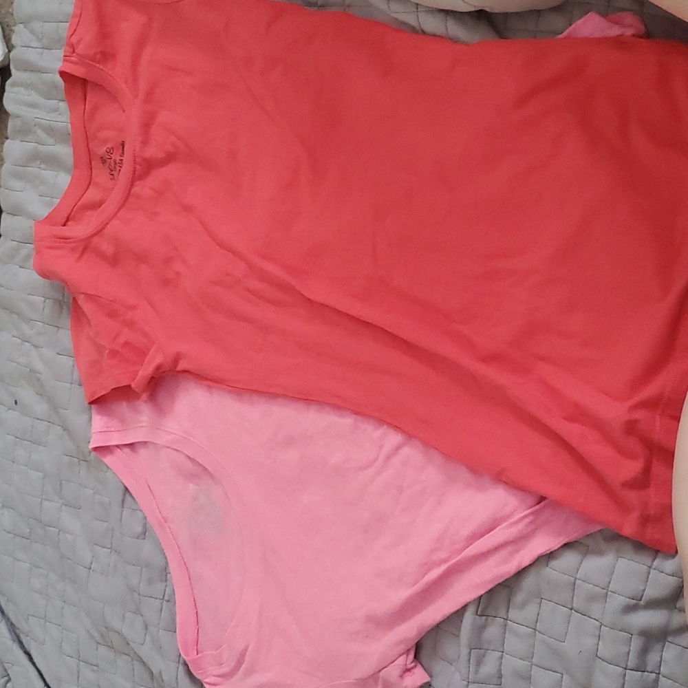 Two pink and coral round neck shirts